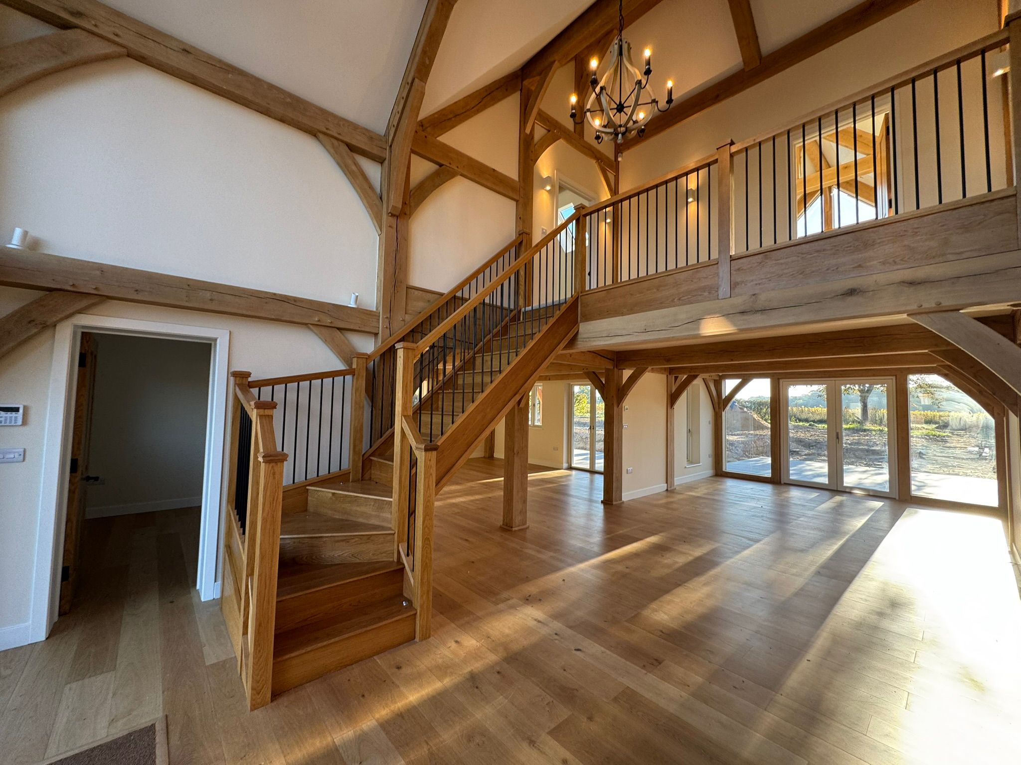 Oak-framed double-height great hall interior delivered by Jigsaw Construction