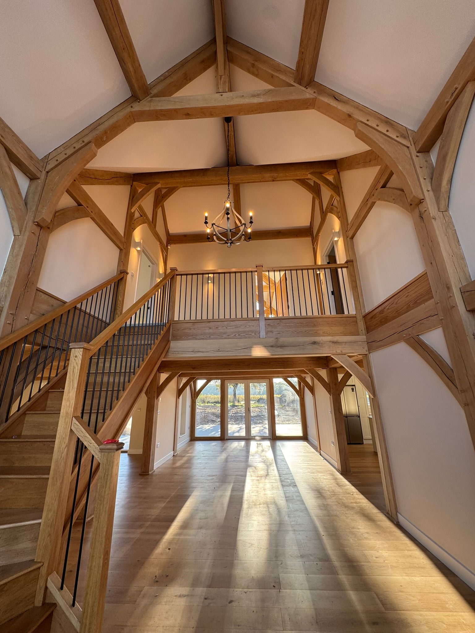 Oak-framed great hall interior with apex trusses delivered by Jigsaw Construction